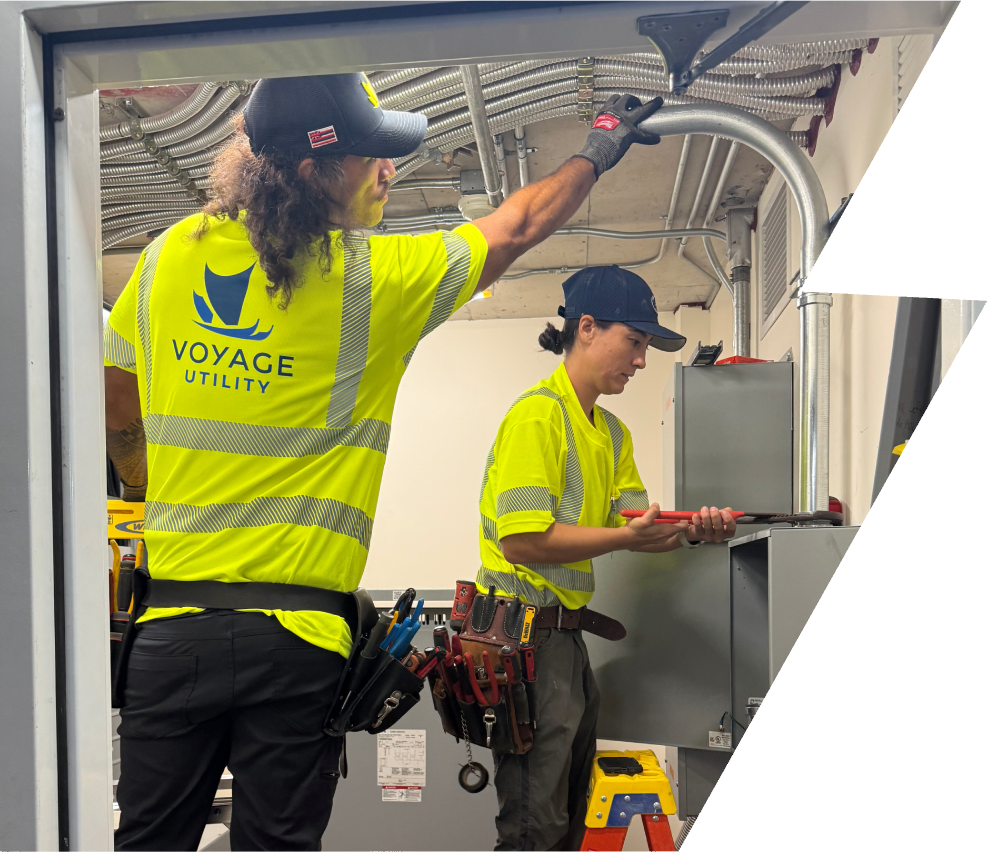 Two Voyage Utility technicians repairing